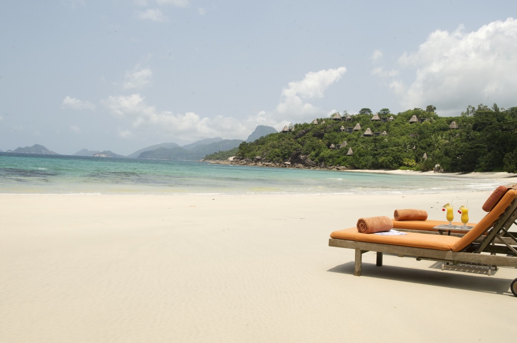 Maia Luxury Resort & Spa - Beach With Deck Chairs.jpg